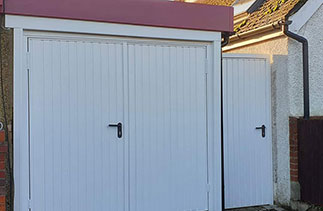 A Set of Garador White steel side hinged Garage Doors in the Carlton style. With a matching side door. Fitted in Maidenhead, Berkshire. The Burgundy cladding was fitted by a Window company.