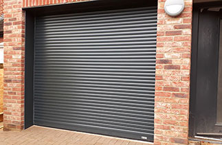 A Sws Seceuroglide 55mm Compact Insulated Roller Shutter Garage Door in Anthracite Grey. Fitted in Bordon, Hampshire