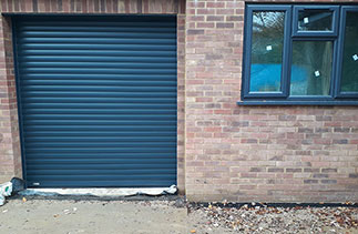 A Sws Seceuroglide Excel Insulated Roller Shutter Garage Door in Anthracite Grey. Fitted in Ottershaw, Surrey