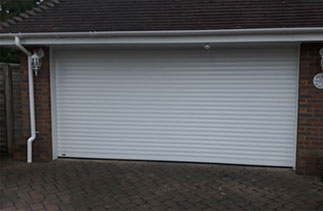A Sws Seceuroglide Excel Insulated Roller Shutter Garage Door in White. Fitted in Seale, Farnham Hampshire