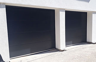 Two Carteck 40mm insulated Solid Rib sectional garage doors. Fitted in West Byfleet, Surrey.