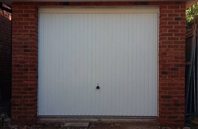 A Garador Carlton framed retractable plus door with steel frame. Fitting behind the opening