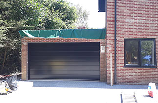 A Carteck Center rib Black sectional garage door. Fitted in Maidenhead, Berkshire.