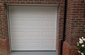 A Carteck Georgian style White sectional garage door. Fitted in Woodley, Berkshire.