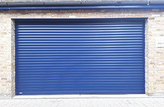 A Sws Seceuroglide Excel insulated Roller Shutter Garage Door in Navy Blue. Fitted in Windsor, Berkshire.