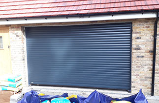 A Sws Seceuroglide Excel roller shutter garage door. In Anthracite Grey. Fitted in Camberley. Surrey.