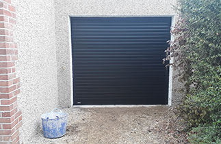 A Sws Seceuroglide Excel roller shutter garage door in Black. Fitted in Godalming. Surrey.