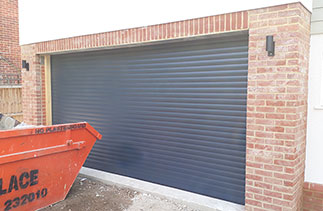 A Sws Seceuroglide Excel roller shutter garage door in Anthracite Grey. Fitted in West By Fleet, Surrey.
