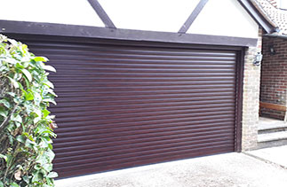 A Sws Seceuroglide Excel Roller shutter garage door in Rosewood. Fitted in Grayshot, Surrey.