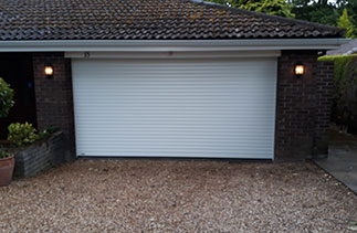 A Sws Seceuroglide Excel white roller shutter garage door. Fitted in Sunningdale. Berkshire.