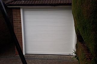 A White Sws Seceuroglide Compact Roller shutter garage door. Fitted in North Wonborough. Hampshire.