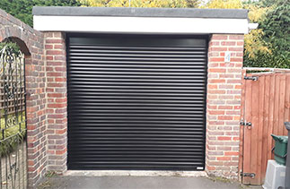 A Black Gliderol 55mm Compact insulated Roller Shutter Garage Door fitted in Camberley, Surrey.