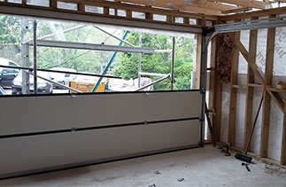 The assembling of a Carteck Sectional garage door. Fitted in Wokingham, Berkshire.