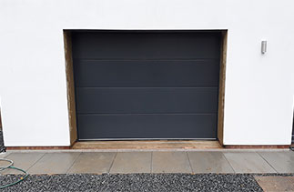 A Carteck solid rib sectional Garage Door in Anthracite Grey. Fitted in Ascot, Berkshire.