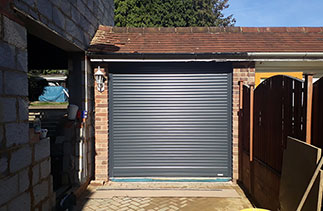 A Gliderol 55mm compact roller shutter garage door in Anthracite Grey. Fitted in Camberley, Surrey