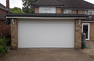 A Gliderol White insulated Roller Shutter garage door. Fitted in Farnborough, Hampshire.