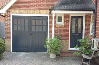 New Garage Door and matching Front Door. The garage door is a GRP Sherwood style in Anthracite with a matching Anthracite Chassis and a white steel frame. The door was supplied with translucent windows which allow light in to the garage but you cannot clearly see through them. The front door is a Door-stop 2 panel 2 square door in Anthracite with Flare design glass, a chrome handle, Chrome letter box and Chrome door knocker. Fitted in Camberley Surrey.