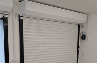 The inside view of a Sws Seceuroglide roller shutter garage door in a Black wood grain on White slats. Fitted in Ascot, Berkshire.