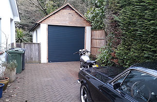 A Seceuroglide Excel insulated roller shutter garage door. Fitted in Bisley, Surrey.