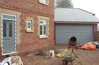 A Seceuroglide insulated roller shutter garage door supplied in Ral 7042 to match the front door. Fitted to plot 3 in Alton, Surrey.