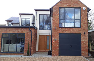 A set of Carteck 40mm insulated side hinged garage doors in Anthracite. Garage door fitted in Surbiton, Surrey.
