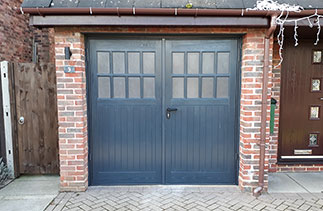 A Set of Sherwood style GRP side hinged garage doors in Anthracite Grey with a matching steel frame. Garage doors fitted in Camberley, Surrey.