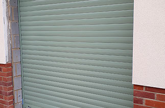 A Sws Seceuroglide Excel insulated roller shutter garage door in Chartwell Green. Fitted in Camberley, Surrey.
