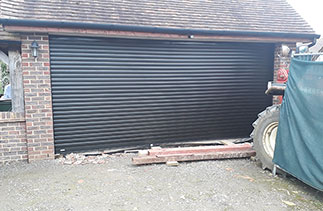 A Sws Seceuroglide Excel roller shutter garage door in Black. Fitted in Horsham, West Sussex.