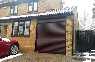 A Sws Seceuroglide Excel Roller Shutter Garage Door in Rosewood. Fitted in Camberley, Surrey.