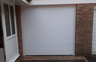 A White Gliderol 55mm compact insulated Roller Shutter Garage Door fitted in Yatley, Surrey.