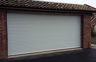 A White Seceuroglide Excel insulated roller shutter garage door fitted in Chichester, West Sussex.